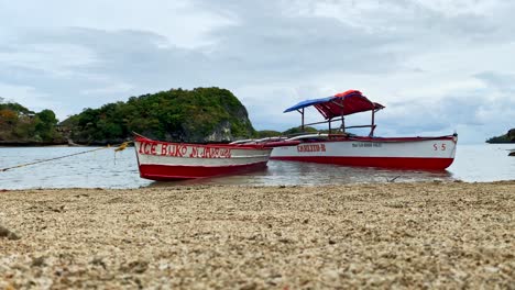 Two-Philippine-Bangka-Boats-On-the-Shore-of-a-Sandy-Beach