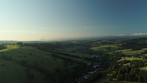 Idyllic-Landscape-Of-The-Alps-With-Pastureland-And-Rolling-Hills---aerial-drone-shot