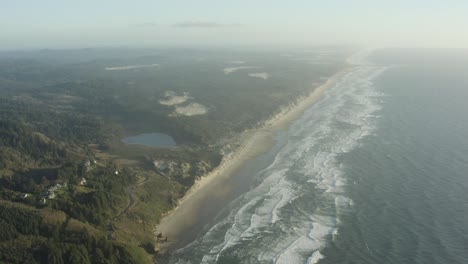 Wide-aerial-of-Oregon-coast-and-long-sandy-beach
