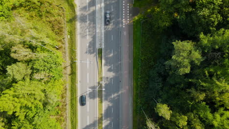 Aerial-sideways-pan-shot-of-cars-driving-along-highway-road