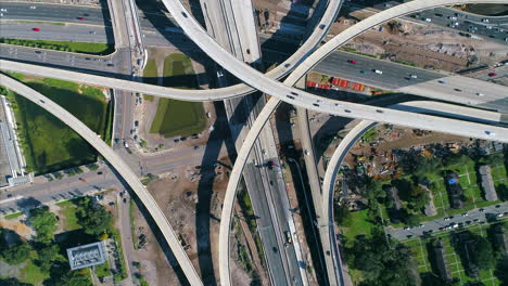 Top-down-view-of-complex-highway-interchange-with-busy-traffic