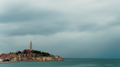 Time-lapse-of-clouds-and-rain-blowing-by-the-skyline-of-the-city-of-Rovinj-in-western-Croatia