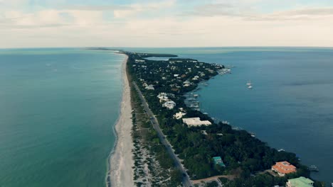 A-view-down-the-length-of-Captiva-Island,-FL-from-a-drone