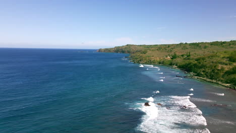 Blue-Pacific-Ocean-waves-reaching-Maui-shore,-secluded-beach-aerial-view