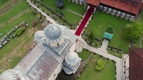 Old-Orthodox-Monastery-Dome-Roof-Of-Mileseva-In-Serbia---aerial-top-view