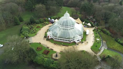 Sefton-Park-Palm-house-Liverpool-Victorian-exotic-conservatory-greenhouse-aerial-botanical-landmark-dome-building-descend-tilt-up