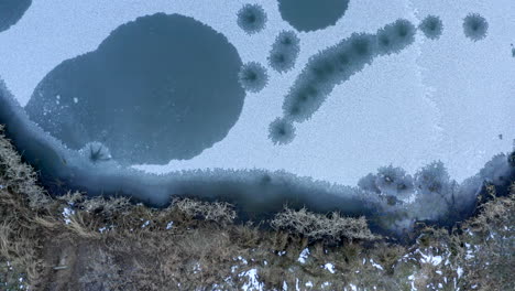 Frozen-pond-water-drone-footage-aerial