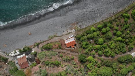 Aerial-of-idyllic-Faja-dos-Padres-with-green-arable-land-on-volcanic-shore