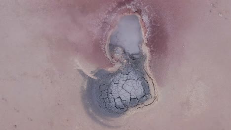 Acidic-mudpot-with-sulphur-vapor-coming-from-volcanic-activity,-aerial