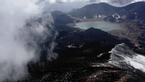 Jade-Dragon-Snow-Mountain-peak-massif-in-Lijiang-Yunnan,-China,-4K-aerial-view