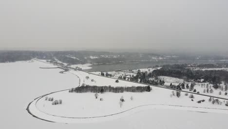Kaunas-hydroelectric-power-plant-frozen-in-cold-winter-season,-aerial