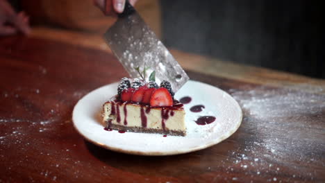 Chef-throw-sugar-flour-to-cheesecake-with-butcher-knife-slow-motion