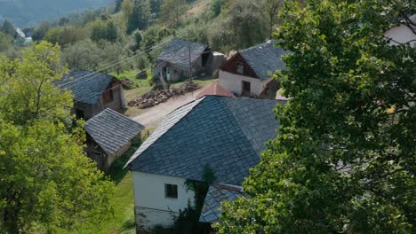 Traditional-slate-stone-tiling-roof-on-old-European-rural-cottage-buildings