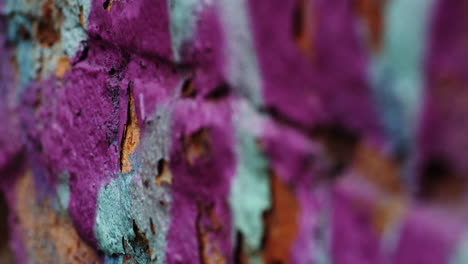 Purple-and-blue-green-chipped-paint-background,-focus-pull