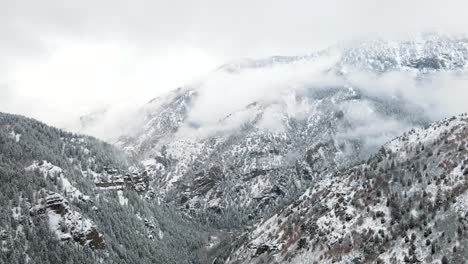 Foggy-Clouds-Time-Lapse-over-Snowy-Wasatch-Utah-Mountains,-Static