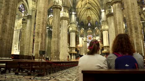 Static-wide-shot-inside-holy-milano-dome-cathedral-with-tourist-visiting-beautiful-architecture