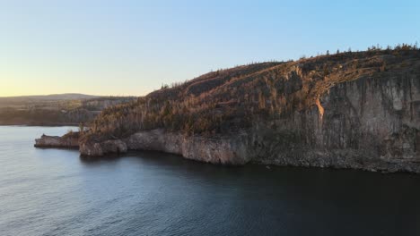 aerial-view-of-palisade-head,-lake-superior-shoreline-in-north-shore-minnesota-during-golden-hour,-wonderful-landscape,-visit-minnesota-only-in-MN