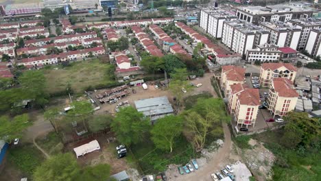 Real-estate-of-Langata-nairobi-kenya,-Real-estate-of-drone-moving-downwards-from-air,-settlement-of-houses-in-nairobi-Estates,-news-houses-in-nairobi-kenya