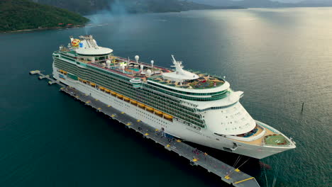 Cinematic-wide-drone-shot-of-a-docked-cruise-ship-in-Haiti