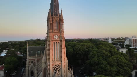 Aerial-view-orbiting-around-San-Isidro-Cathedral-spire-at-sunset-in-Buenos-Aires