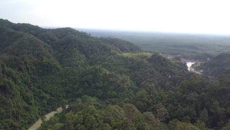 Scenic-Tropical-Rainforest-Heritage-of-Sumatra-shrouding-the-island-hills,-Indonesia---Aerial-wide-high-panoramic-shot
