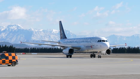 Turkish-Airlines-Airbus-A320-Behind-Follow-Me-with-Beautiful-Mountains