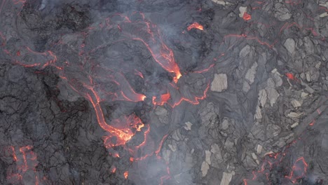 Steaming-Hot-Lava-Flows-Into-Cracked-Ground-During-Volcanic-Eruption-Of-Fagradalsfjall-In-Reykjanes-Peninsula,-South-Iceland