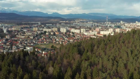 Aerial-shot-circling-around-the-city-of-Ljubljana,-Slovenia-from-a-distance