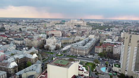 Drone-shot,-aerial-over-downtown-Bucharest-and-its-iconic-buildings