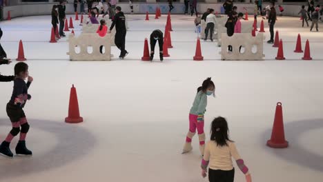 People-of-all-ages-are-seen-enjoying-indoor-ice-skating-at-a-shopping-mall-in-Hong-Kong