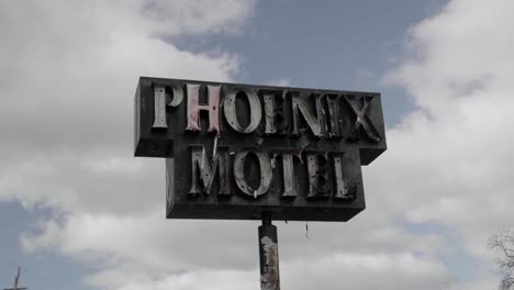 Burnt-Sign-That-Says-"Phoenix-Motel"---Aftermath-of-Southern-Oregon-2020-Wildfires---4K