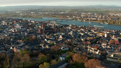 Mainz-aerial-drone-shots-on-a-warm-spring-day-showing-the-blue-river-in-the-back-getting-and-the-Cathedral-church-in-the-middle