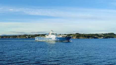 Offshore-multi-purpose-vessel-Stril-Merkur-sailing-Norway-fjord-at-sunny-day