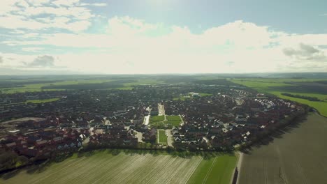 A-drone-reveal-shot-of-the-village-of-Aylesham-with-the-Persimmon-and-Barretts-new-build-houses
