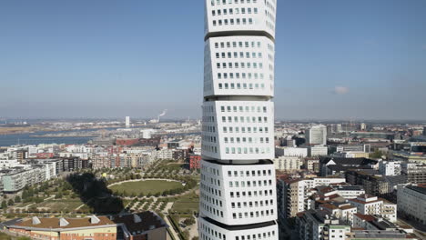 Turning-torso-skyscraper-white-building-apartment-office-aerial-drone-skyline-Malmö-Swedish-Sweden-city-wide-view-Scandinavian-design-landscape-visit-local-construction-tall-buildings-Stockholm-high