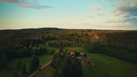 Countryside-Spring-Landscape-With-Fresh-Green-Meadows-And-Forests-Near-Hjo,-Sweden---aerial-shot