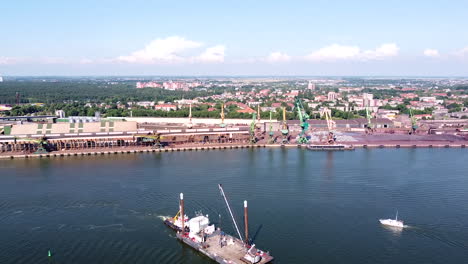 Industrial-part-of-Klaipeda-harbor-and-city-skyline-in-aerial-view