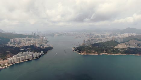 Aerial-shot-of-Hong-Kong-bay-skyline-on-a-cloudy-day