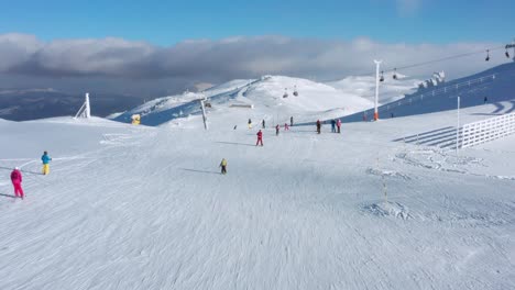 Skiers-on-Jahorina-mountain-slopes,-Bosnia-and-Herzegovina-ski-resort,-aerial
