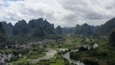 Aerial:-Chinese-karst-mountain-landscape,-Asian-rural-countryside