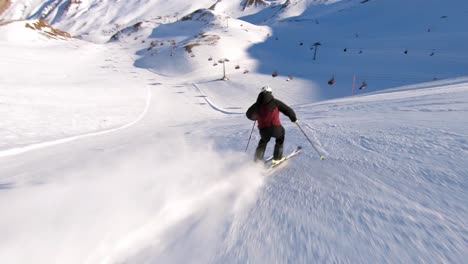 High-speed-skiing-on-a-steep-ski-slope,-male-ski-athlete-with-great-skiing-skills-in-beautiful-mountain-panorama-in-a-austrian-ski-resort