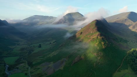 Aerial-fly-through-the-Honister-Pass-in-the-Lake-District,-Cumbria-with-mist