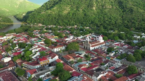 Aerial-view,-Honda,-Colombia,-scenic-valley-and-colonial-town-in-green-landscape-of-Tolima-region,-drone-shot