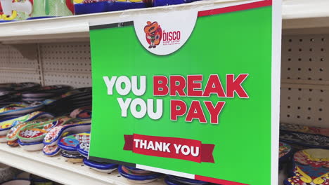 Sign-warning-shoppers-at-a-Mexican-shop-informing-them-that-they-will-be-held-accountable-in-the-event-they-break-any-merchandise-in-the-shop