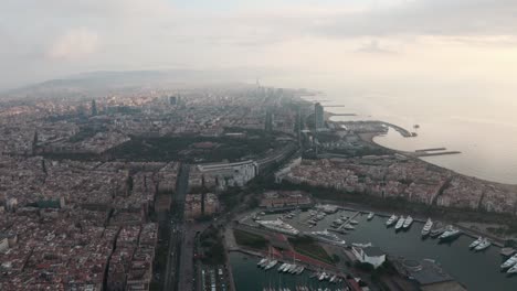 Circling-drone-shot-over-Barcelona-port-and-Coast