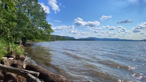 A-hyper-lapse-time-lapse-of-the-beautiful-hudson-river-in-new-york's-hudson-valley-during-early-autumn-on-a-sunny-day-with-blue-skies-and-beautiful-clouds