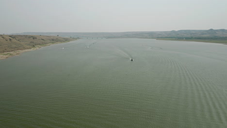 Aerial-Panorama,-Motor-Boat-Speeding-Fast-On-Wide-Lake