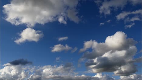 Epic-time-lapse-shot-of-moving-white-and-grey-clouds-against-blue-sky-in-nature---Climate-Change-and-global-warming