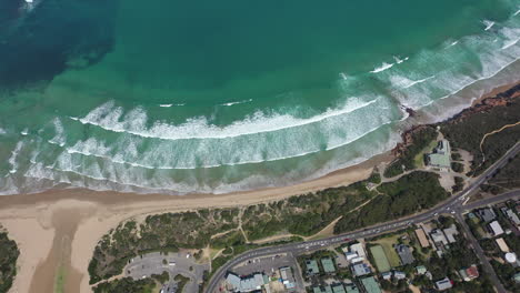 Vertical-aerial-tilts-from-Anglesea-to-shallow-ocean-bay-in-Australia