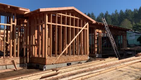 Wooden-frame-House-Under-Construction-On-A-Sunny-Day